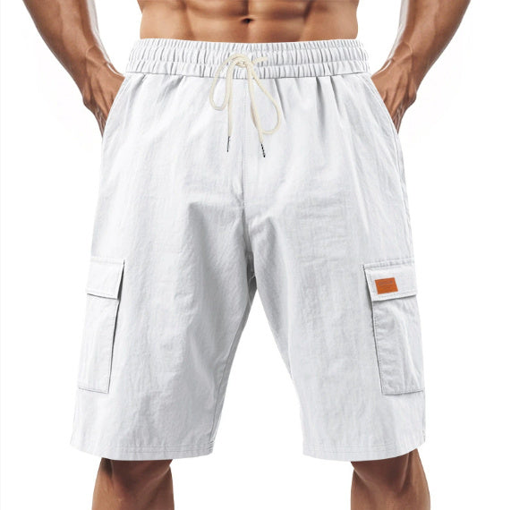 White linen drawstring cargo shorts with elastic waistband and side flap pockets