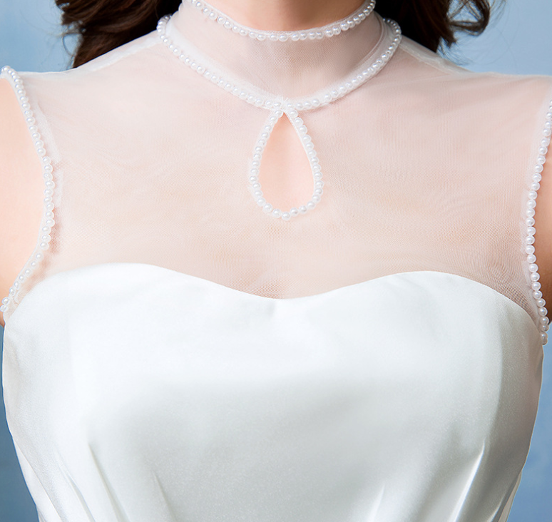 White satin wedding dress with pearl choker neckline and beaded straps