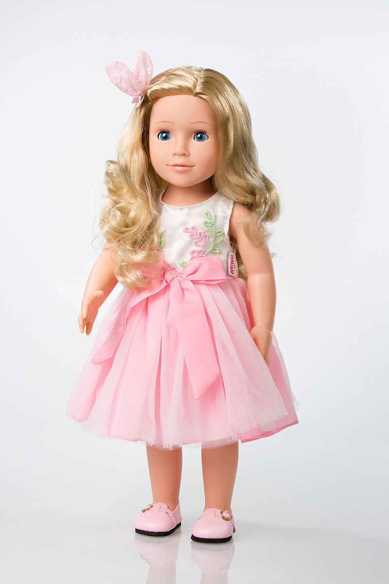 Plastic girl doll in pink embroidered dress with pink bow headband and pink shoes