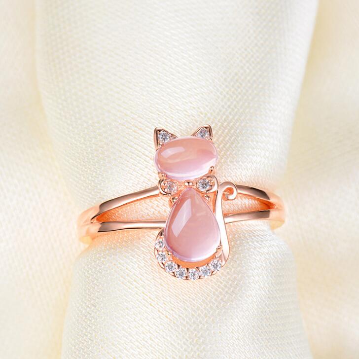 Rose gold cat ring with pink oval crystal and small clear rhinestone accents