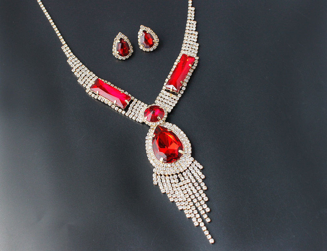 Necklace and stud earrings jewelry set with red gemstones and silver rhinestones