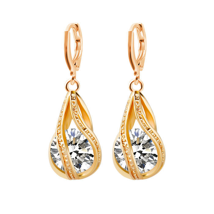 Gold-tone zircon teardrop drop earrings with faceted crystal centers.