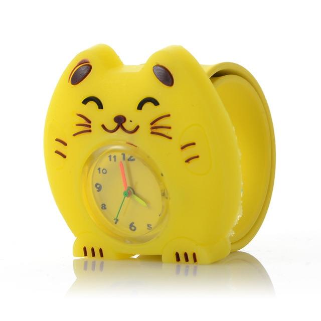 Kids wristwatch with yellow cat-shaped case and round dial on a silicone band