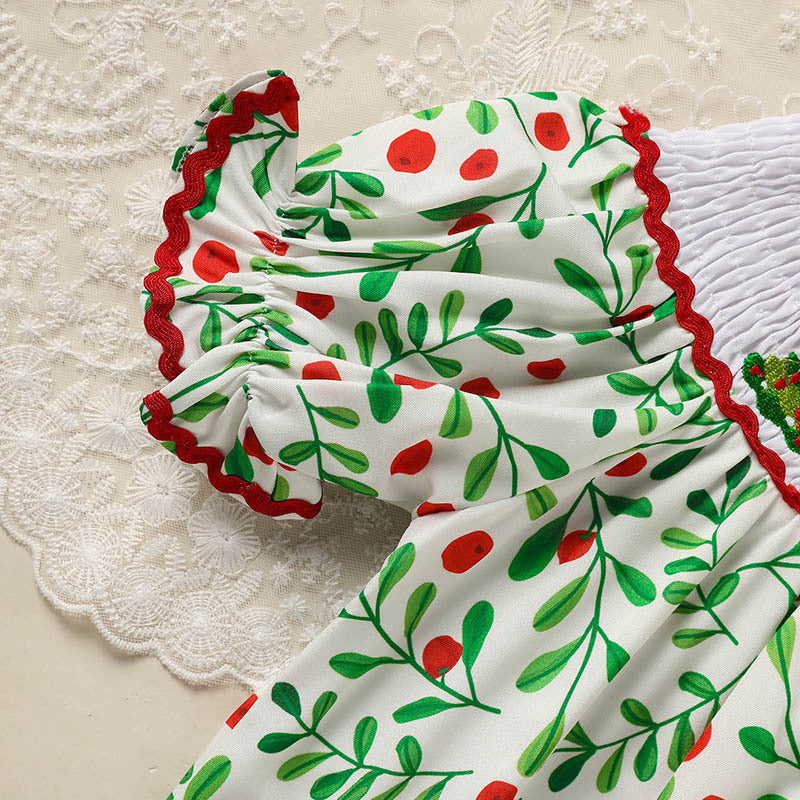 Toddler Christmas dress with white fabric, green and red berry print and red ruffled trim