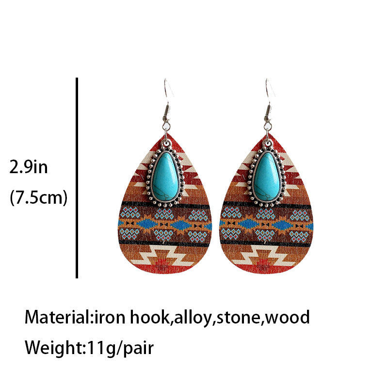 Turquoise teardrop earrings with red-brown tribal fabric pattern and metal hooks