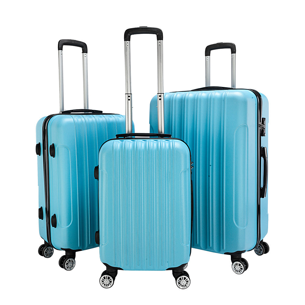3-piece hard-shell luggage set in light blue with telescoping handles and spinner wheels