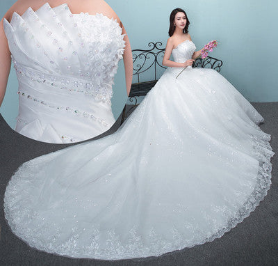 White wedding dress with sweetheart neckline, lace bodice, and full tulle skirt