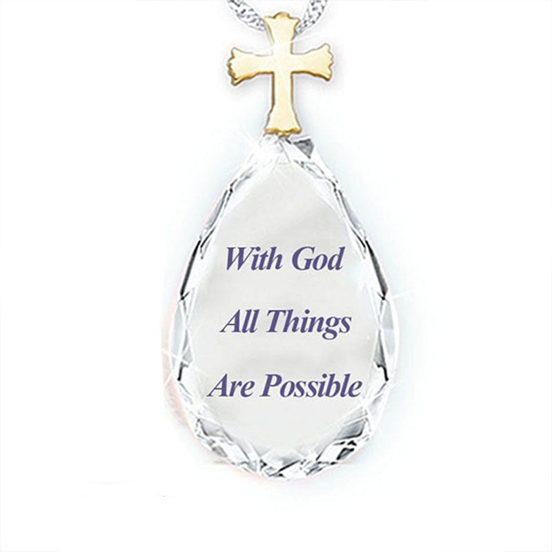 Clear teardrop crystal pendant with gold cross and 'With God All Things Are Possible' text
