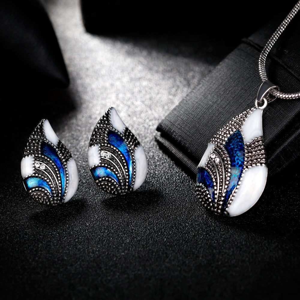 Teardrop earrings and teardrop pendant necklace set in blue, white enamel with sparkle