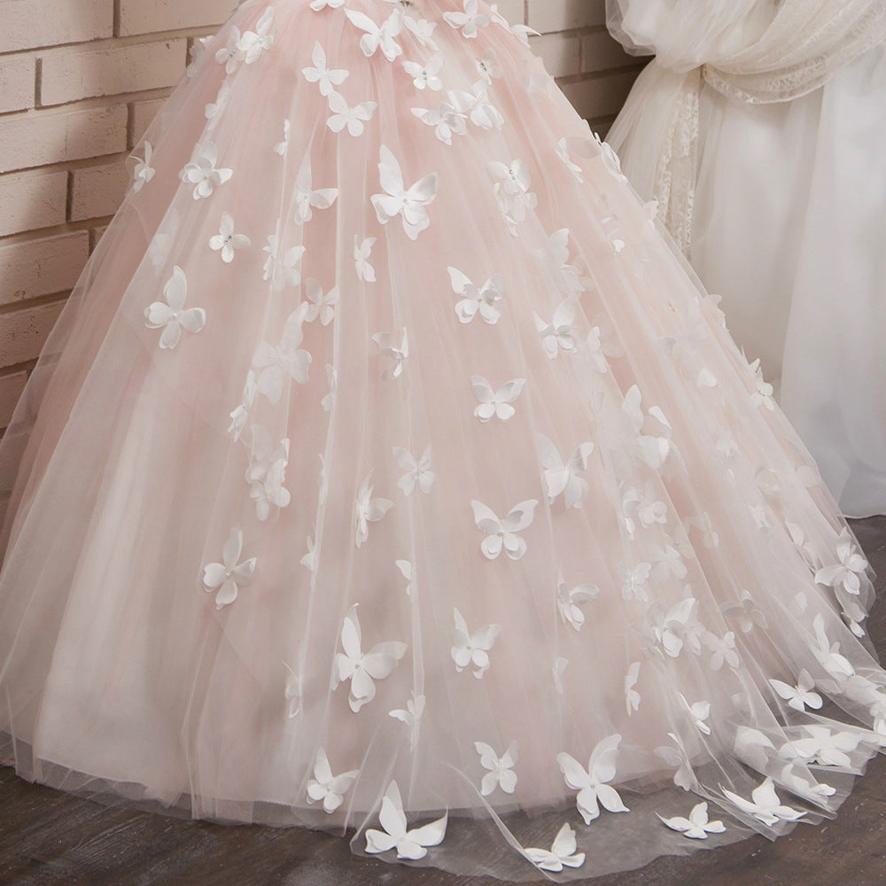 Blush pink tulle skirt with 3D butterfly appliques and layered tulle hem