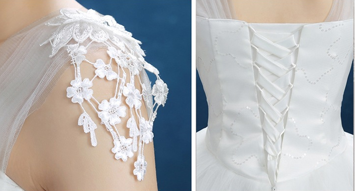 White wedding dress with lace cap sleeves and corset back lace-up detail