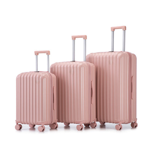 Three-piece ABS spinner luggage set, pink ribbed shells with telescoping handles.