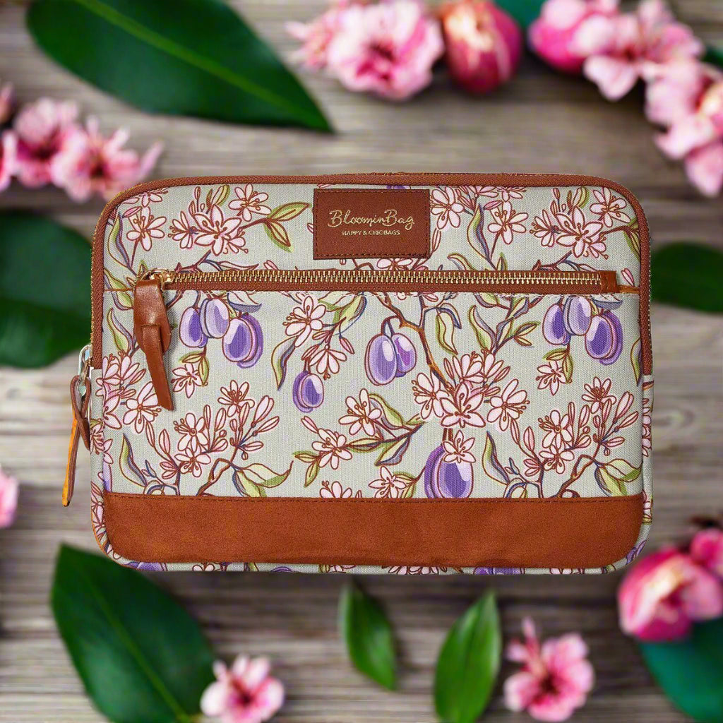 Floral-patterned pouch with brown accents on a white background