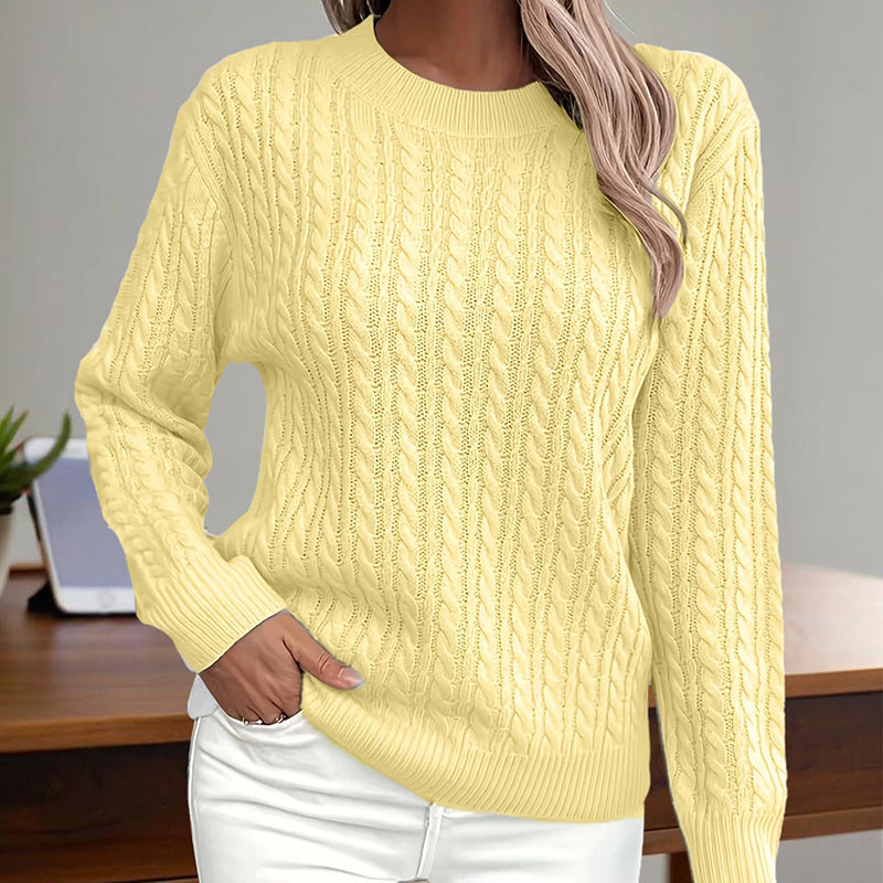 Yellow textured crewneck sweater with long sleeves, pullover knit pattern.
