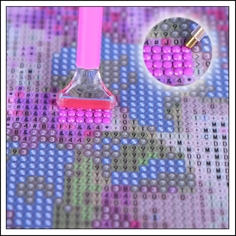 Diamond painting canvas with purple round drills and a pen applicator tip