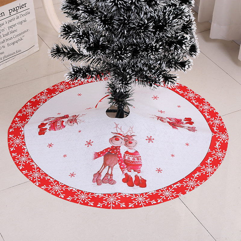 White Christmas tree skirt with red border and appliqué reindeer, snowman, and snowflakes