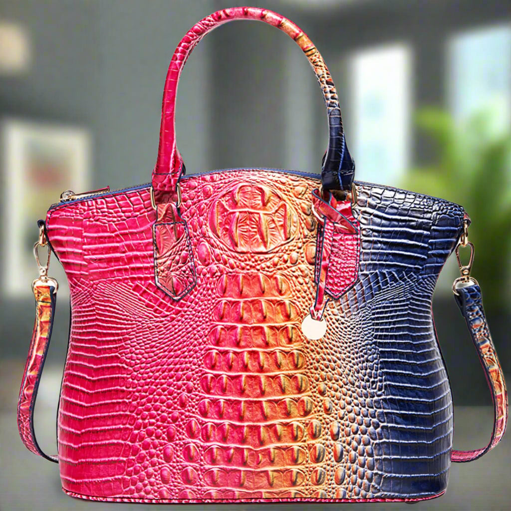 Women’s satchel tote with embossed croc pattern, pink front with navy blue side panels, top handles