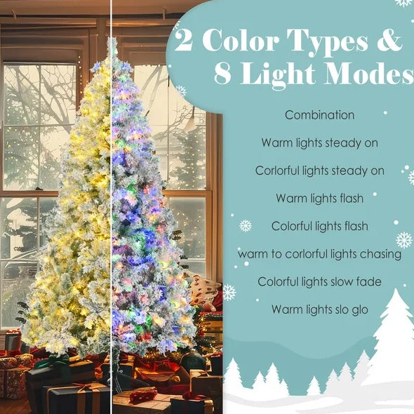 Artificial flocked Christmas tree with multicolor LED lights standing near window
