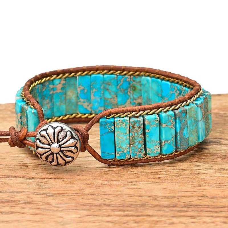 Turquoise stone chain bracelet with brown leather cord and silver flower charm clasp
