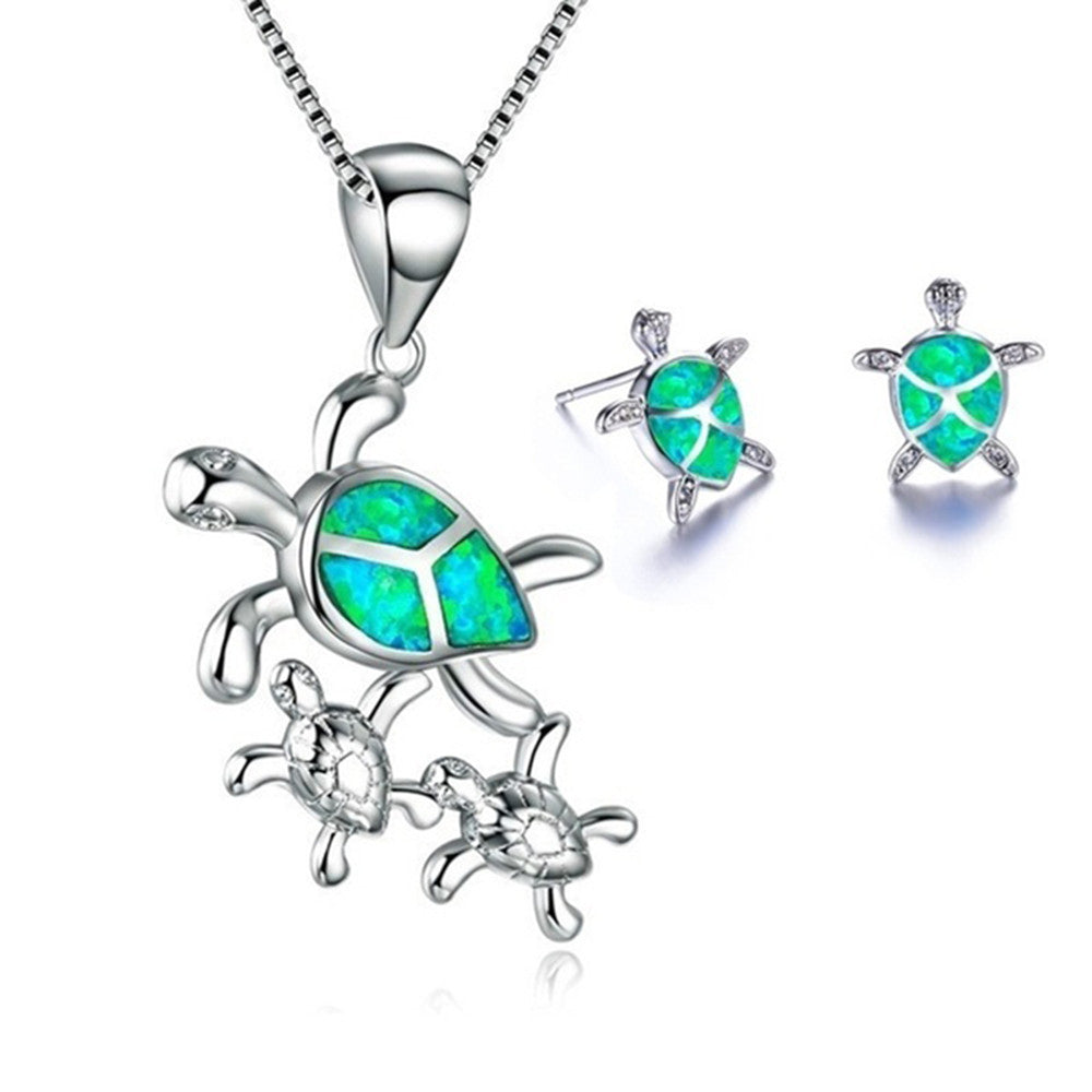 Silver turtle necklace pendant with opal-style stone and matching turtle stud earrings
