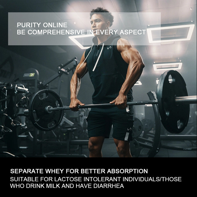 Muscular man performing barbell lift in a gym with weight plates