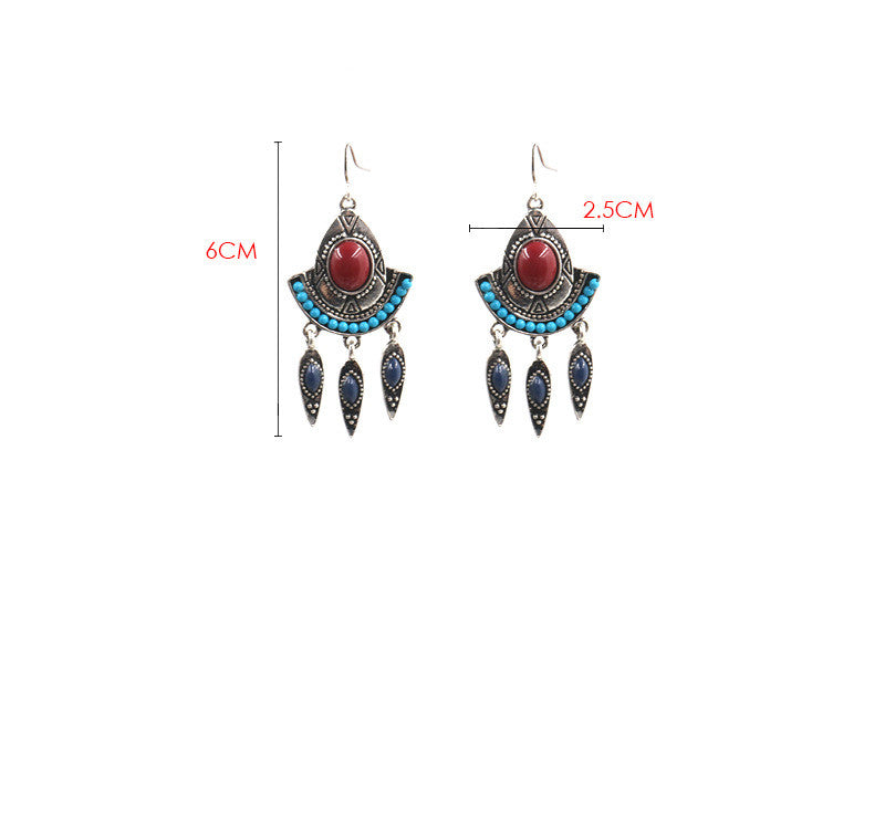 Turquoise and blue drop earrings with red center stone and long tassel-style drops