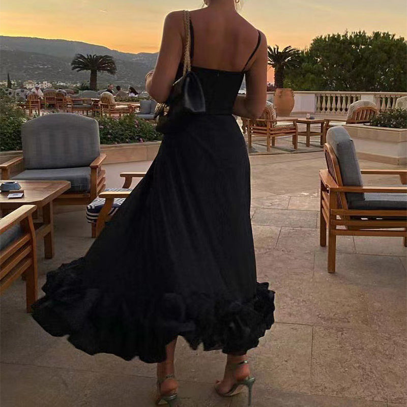 Black A-line dress with spaghetti straps and 3D flower hem ruffle