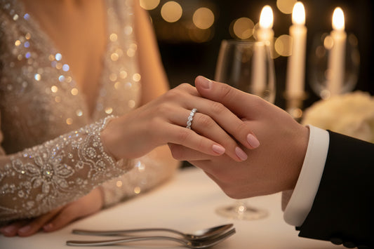 Silver band eternity ring with a row of small sparkling stones on a hand