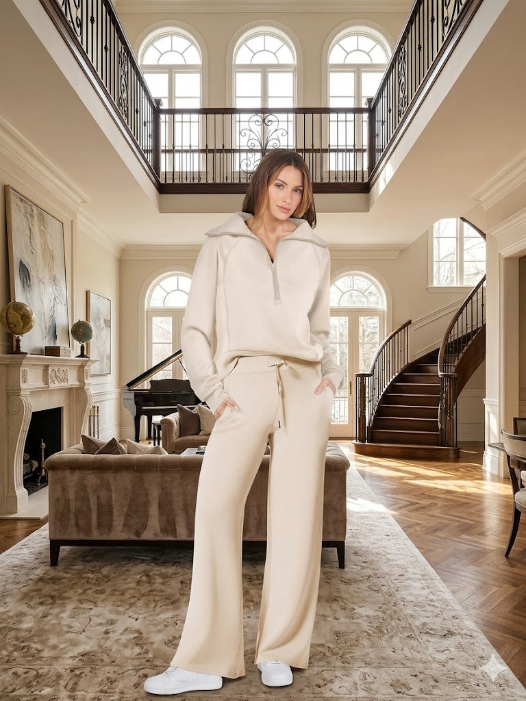 Off-white two-piece tracksuit with quarter-zip long-sleeve top and wide-leg pants