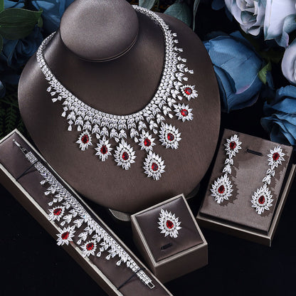 Silver-tone vintage wedding necklace, matching earrings and bracelet set with red stones