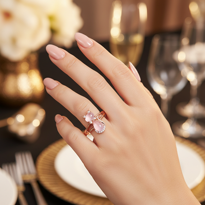 Rose gold cat ring with pink crystal and halo rhinestones, shown with matching bands