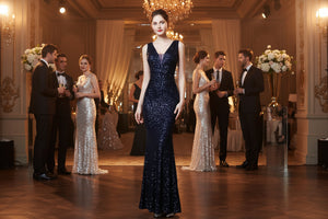 Sleeveless sequined evening gown with fitted silhouette and long mermaid-style skirt.