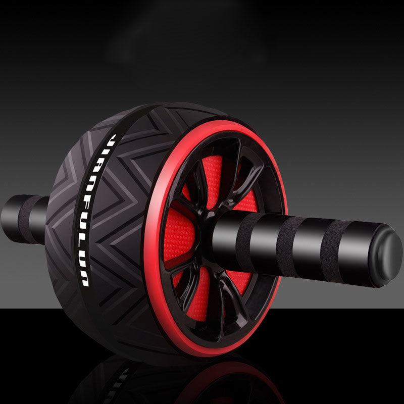 Abdominal wheel close-up with black body and red rim, textured tread and foam handles