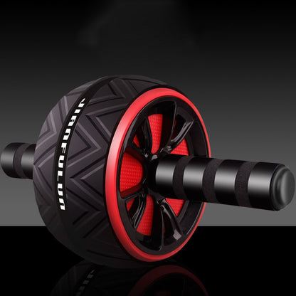 Abdominal wheel close-up with black body and red rim, textured tread and foam handles