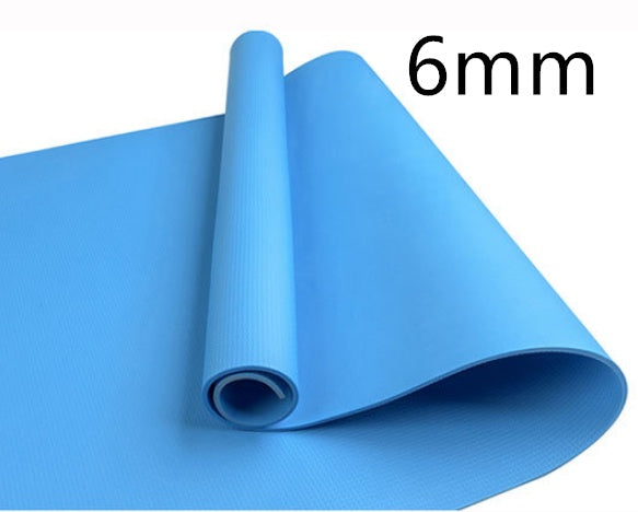Blue 6mm fitness yoga mat, rolled with textured surface and visible open end