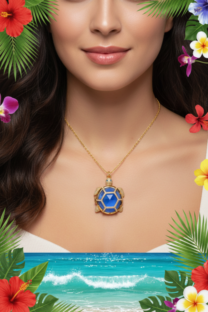 Gold-tone turtle pendant necklace featuring a blue resin medallion center.