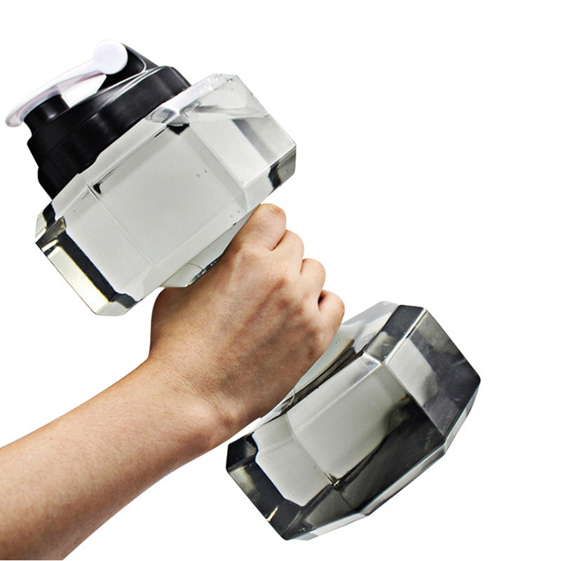 Portable water-injection dumbbell, clear plastic body, shown in hand for grip