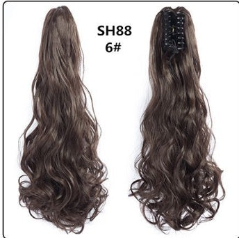 Claw clip ponytail hair extension in dark brown, long wavy strands