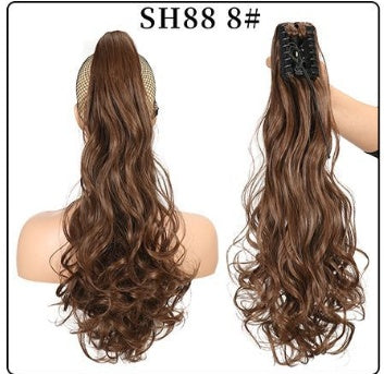 Claw clip ponytail hair extension in medium brown, long wavy strands