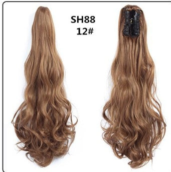 Claw clip ponytail hair extension in caramel blonde, long wavy strands