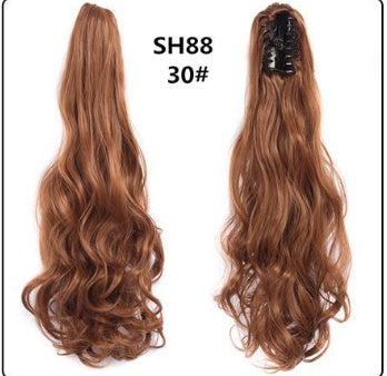 Claw clip ponytail extension with long wavy auburn hair, mesh base and clip