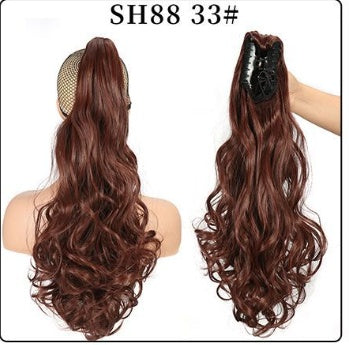 Claw clip ponytail extension with long wavy deep brown hair, mesh base and clip