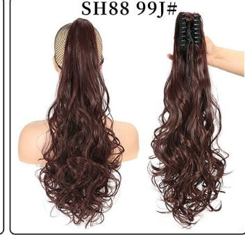 Claw clip ponytail extension with long wavy dark auburn hair, mesh base and clip