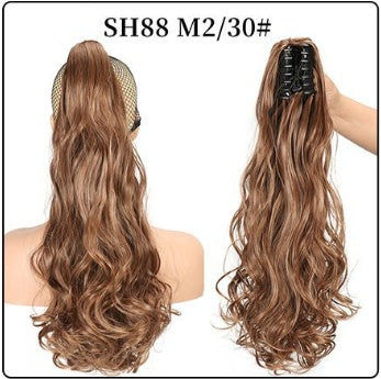 Claw clip ponytail hair extension with long bouncy curls, medium brown hair.