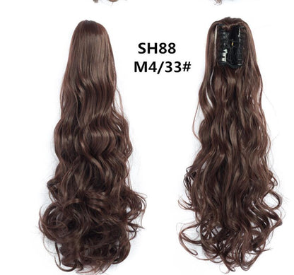 Claw clip ponytail hair extension with long wavy curls, dark brown hair.