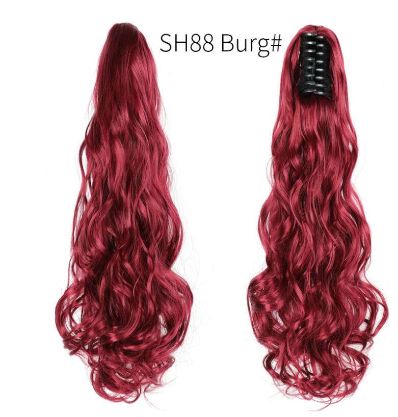 Long wavy burgundy claw-clip ponytail hair extension with black clip, side view