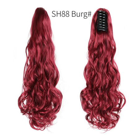 Long wavy burgundy claw-clip ponytail hair extension with black clip, side view