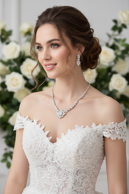 White off-shoulder lace wedding dress with floral necklace and dangling earrings