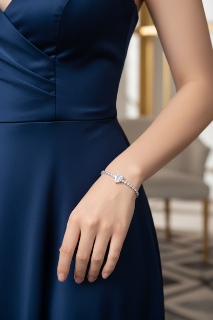 Silver pavé diamond bracelet on wrist, featuring cushion-like linked stones.