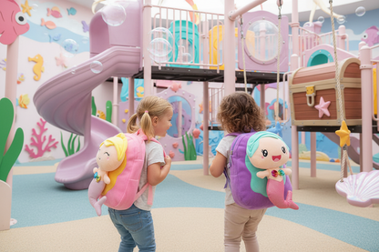 Pink kids school backpack with mermaid face plush and top handle loop
